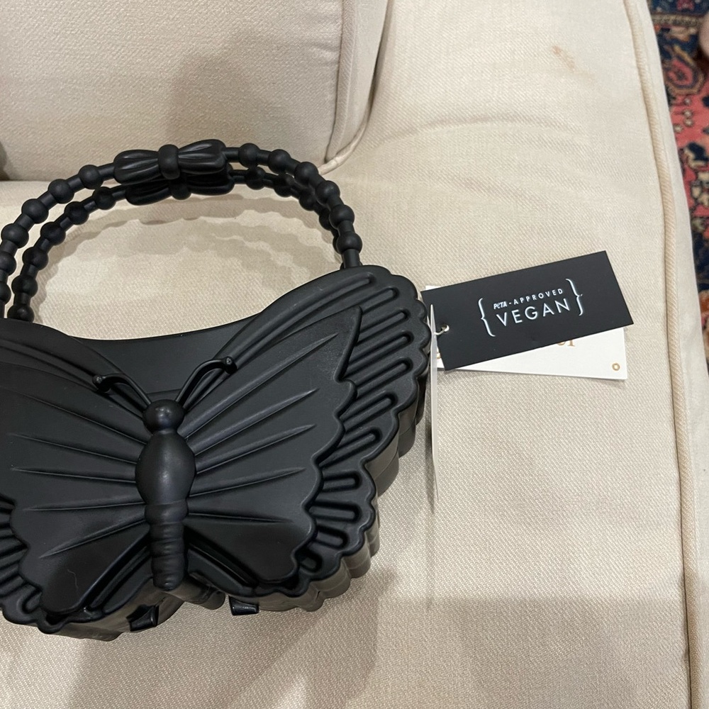 Chic Black Butterfly Clutch
New w tags - Picture 2 of 2